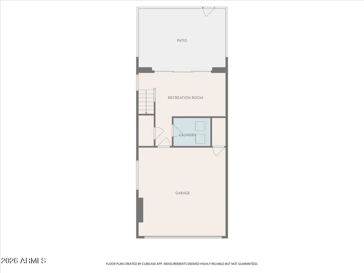 Floor plan showing a garage, recreation room, laundry, and patio. Stairs lead to the recreation room.