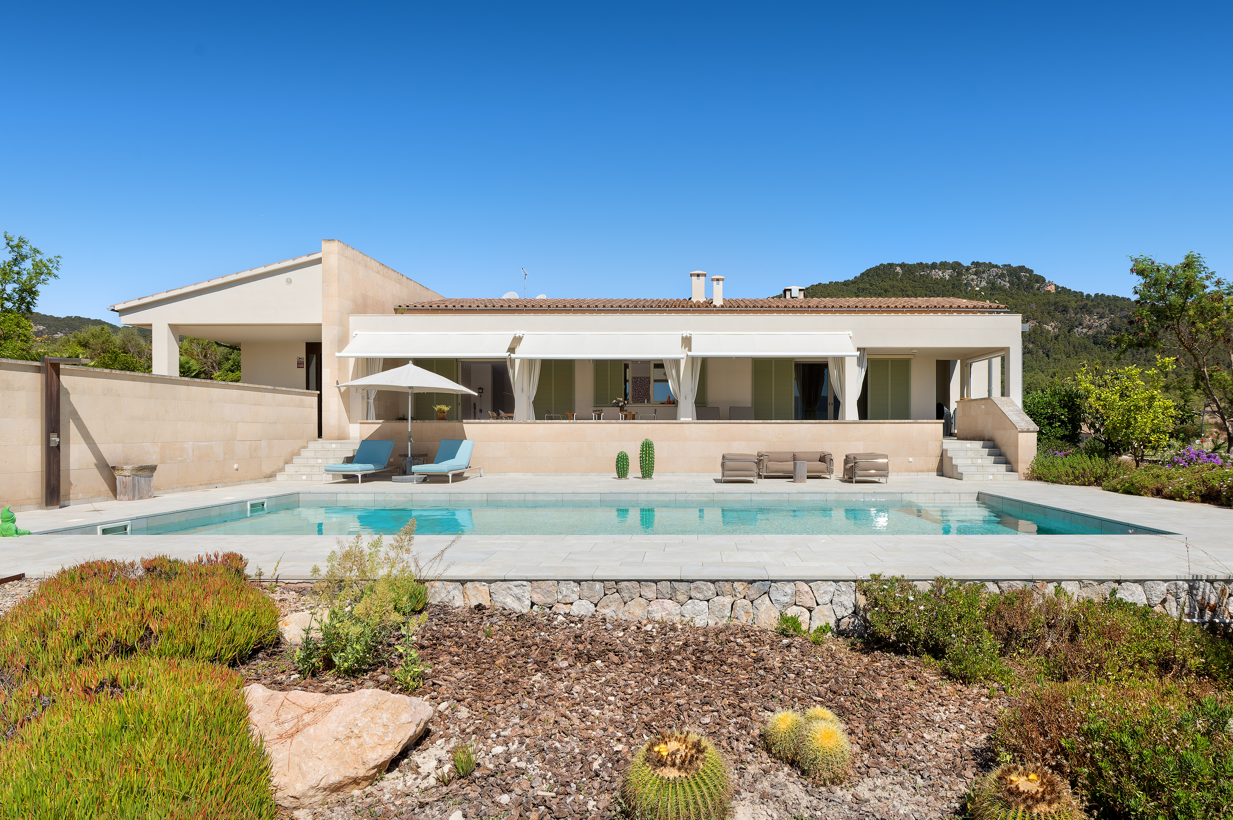 Designer villa with a pool and mountain views in charming Es Capdellà