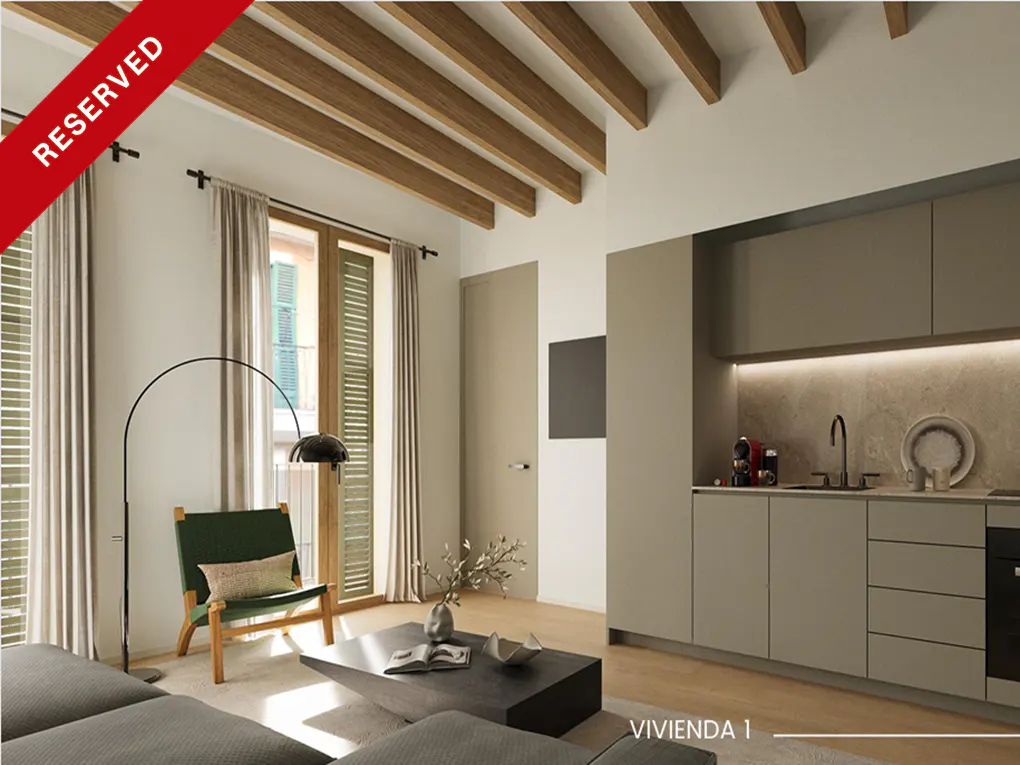 A modern apartment interior with a kitchen, living area, and wooden ceiling beams. A "Reserved" banner is in the upper left corner.