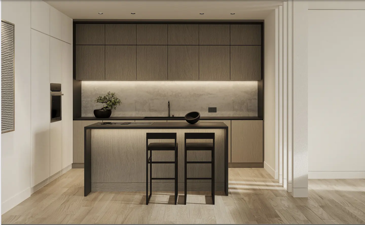 Modern kitchen with wood cabinets, island with two black stools, and light wood floors. A plant sits on the counter.