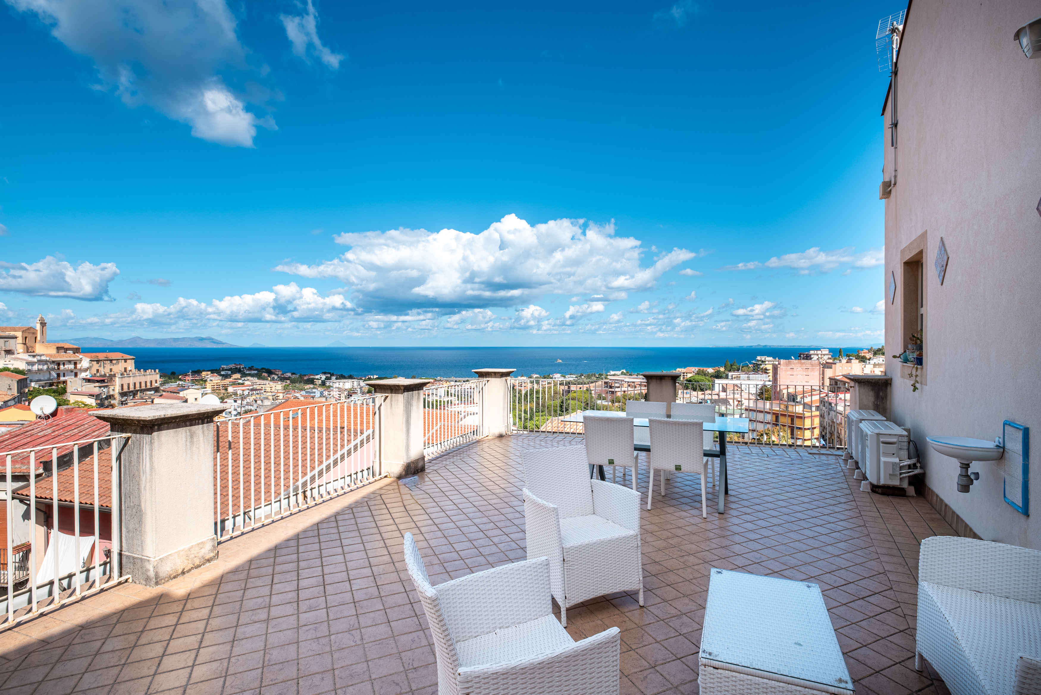 A 19th-century stately home overlooking the Aeolian Islands in the historic center of Patti