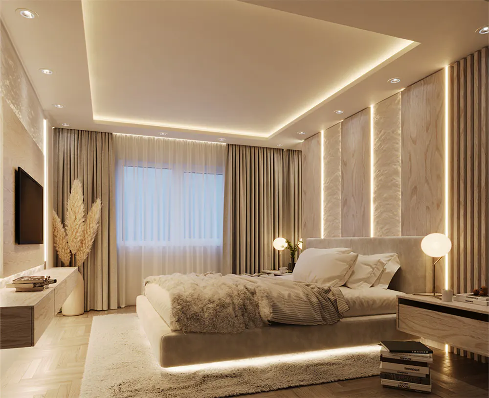 A modern bedroom with a large bed, soft lighting, and neutral color palette. Curtains cover the window, and a TV is mounted on the wall.