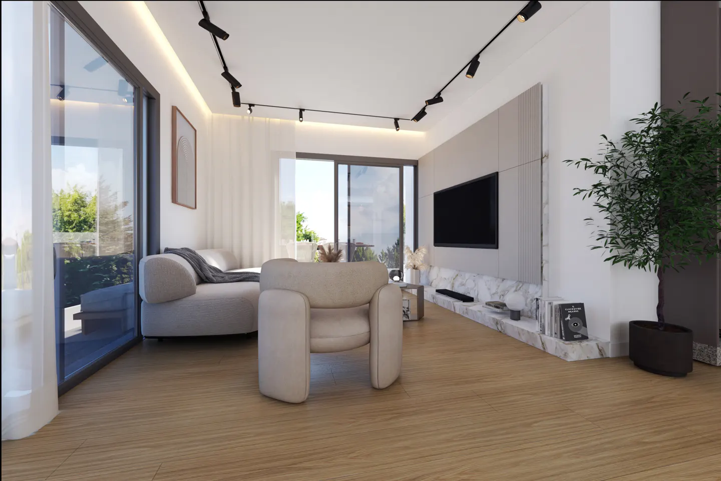Living room with light wood floors, a beige armchair, and a sofa near a large window. A TV is mounted above a marble shelf.