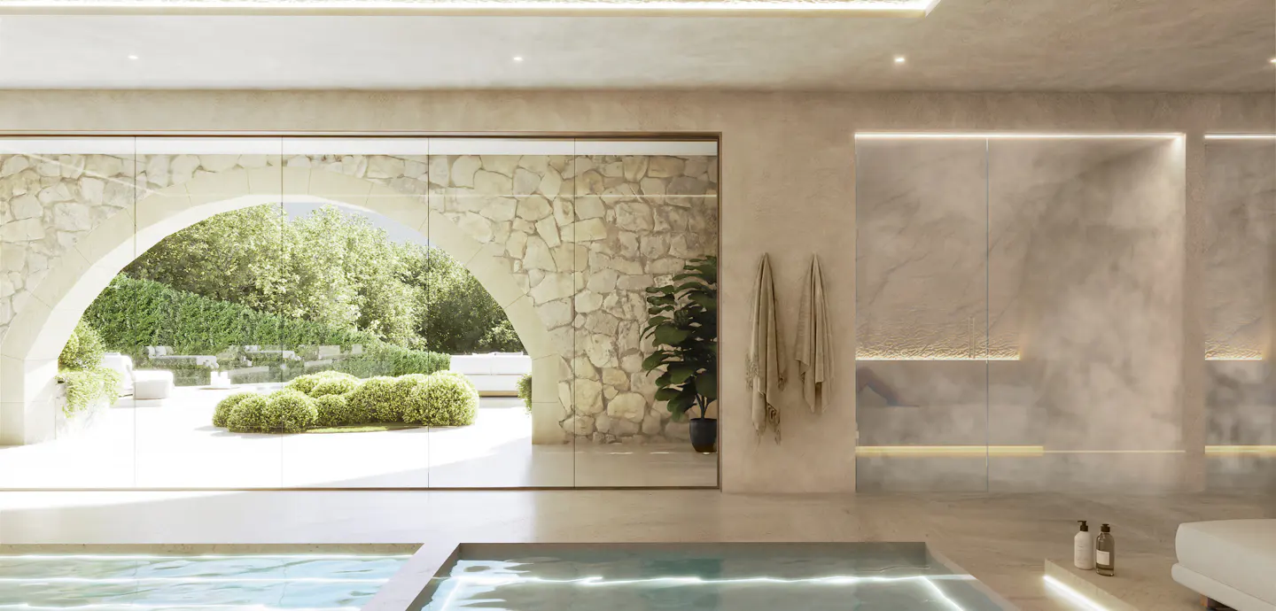 Indoor pool room with stone archway to garden. Towels hang on the wall, and a potted plant sits nearby.