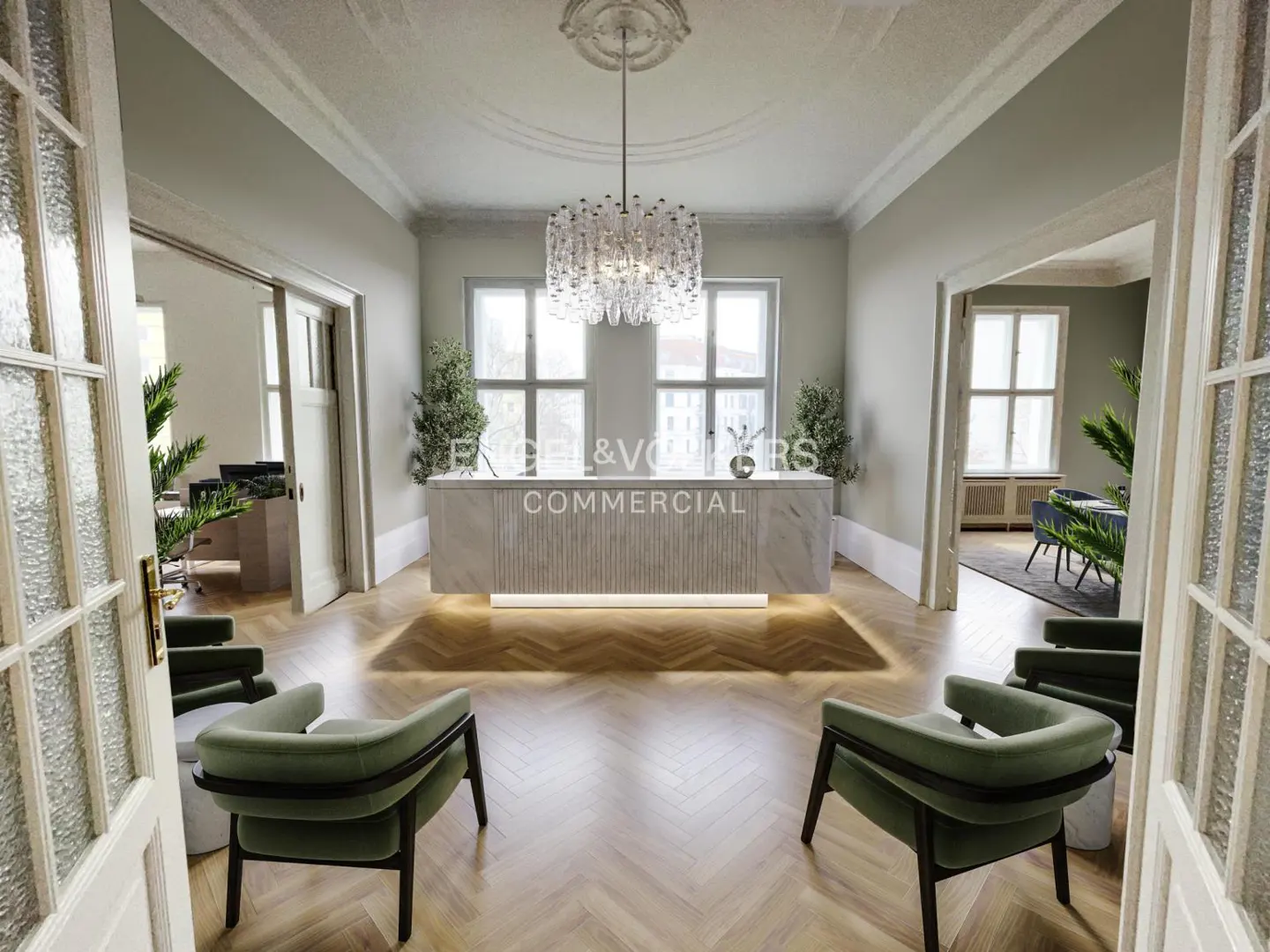 Office reception area with a marble desk, chandelier, and green chairs on a herringbone floor, viewed through open glass doors.