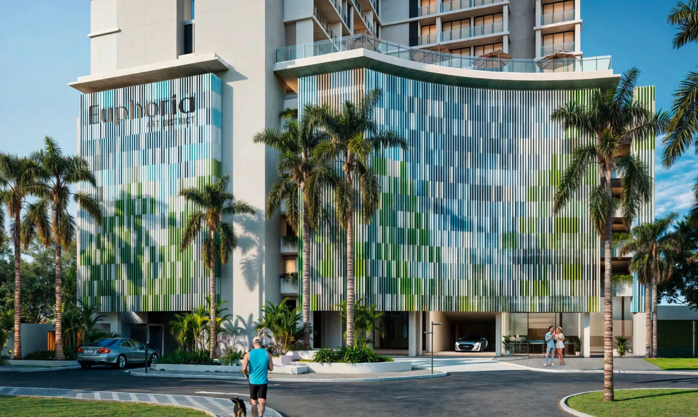 Exterior view of Euphoria Art District building with blue and green facade, palm trees, and people walking.