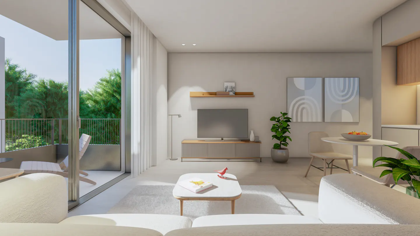 Bright living room with white sofa, TV, and balcony view of green trees. A white coffee table has a book and red bird figurine.