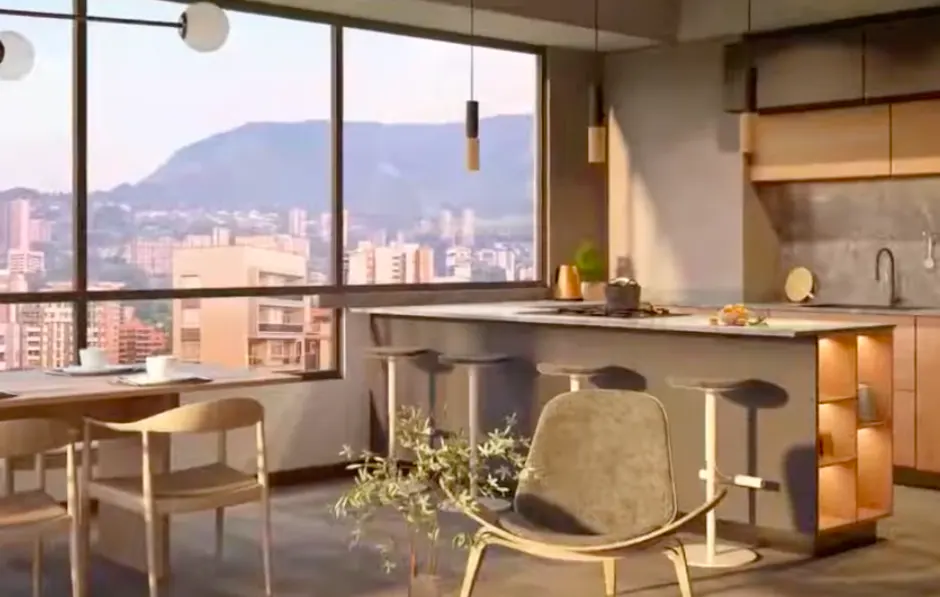 A modern kitchen with a large window overlooking a city and mountain range. There is a dining table, island with stools, and a comfortable chair.