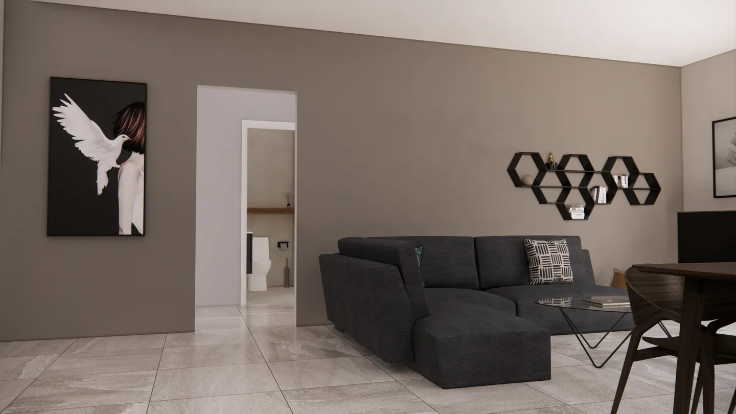 Living room with gray walls, a dark gray sectional sofa, and a black and white painting of a woman holding a white dove.