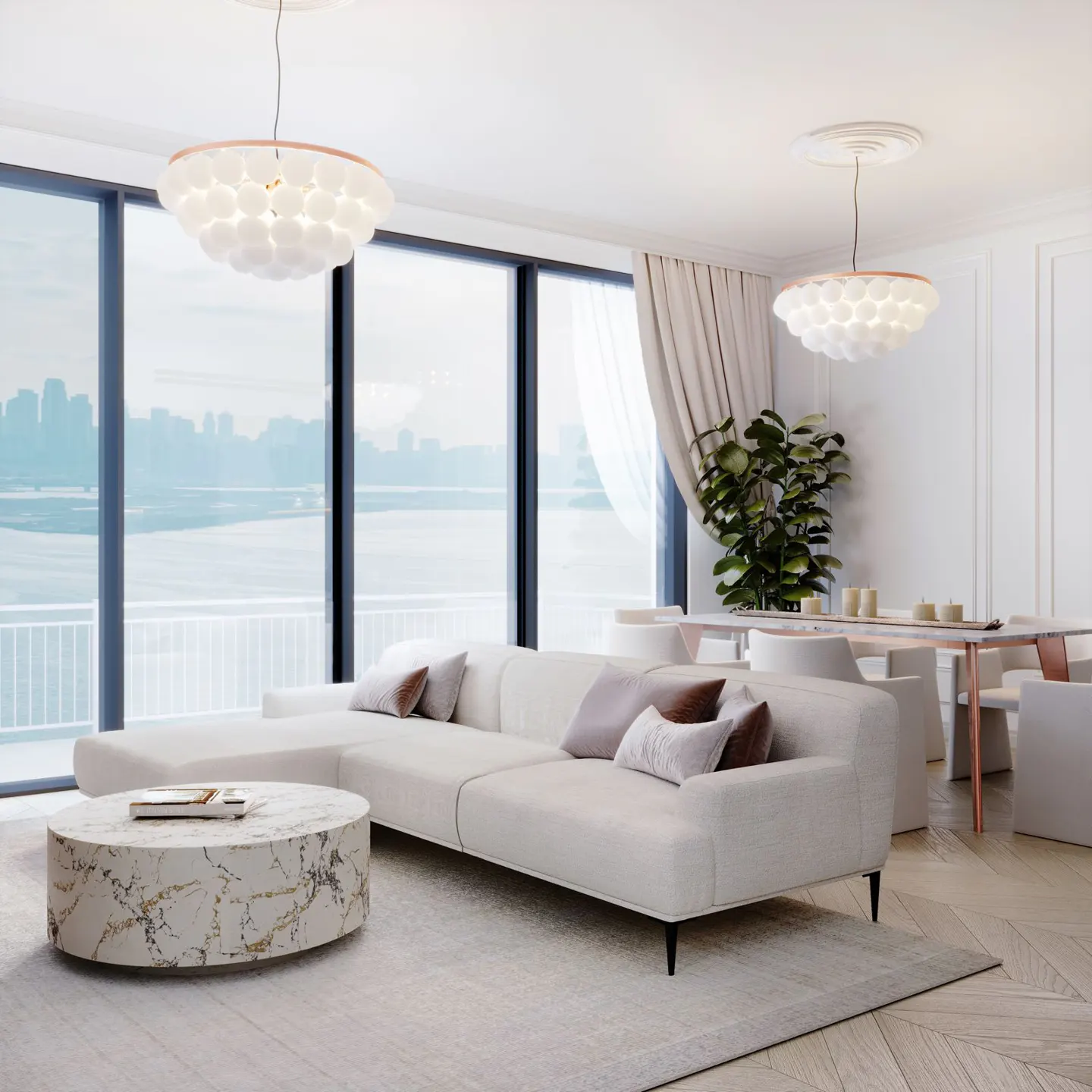 Bright living room with a white sectional sofa, marble coffee table, and large windows overlooking a city skyline. Two modern pendant lights hang from the ceiling.