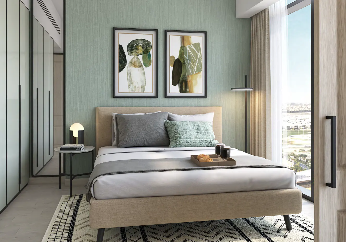 Bedroom with a tan bed, gray and green pillows, and a tray with food. Two abstract art pieces hang above the bed on a light green wall. A large window is on the right.