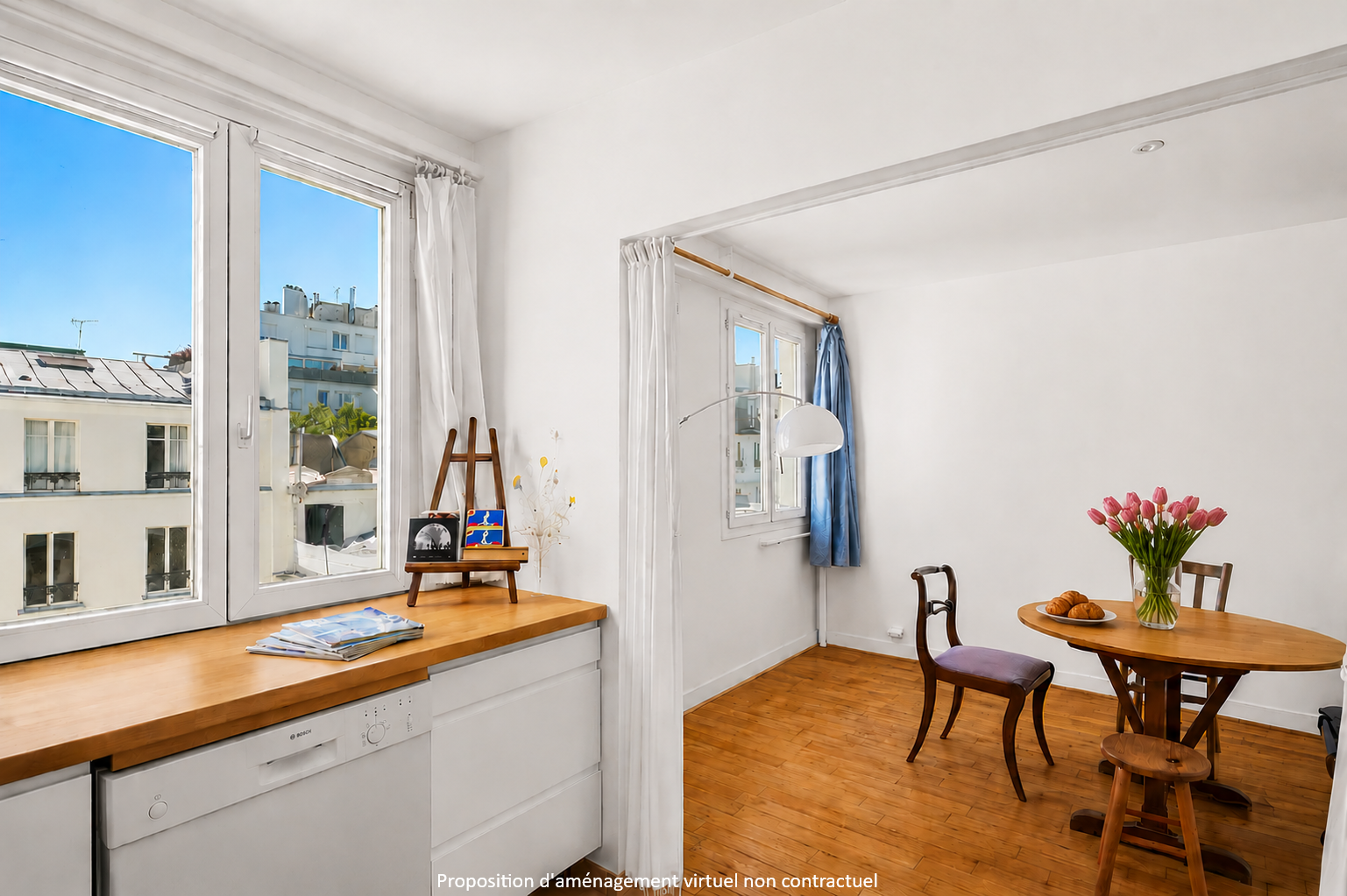 Elegant character apartment in a former 19th-century Parisian workshop—light, quiet, and Montmartre spirit
