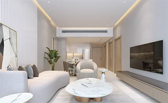 Bright, modern living room with a curved white sofa, marble coffee table, and a large TV on the wall. Dining area visible in the background.
