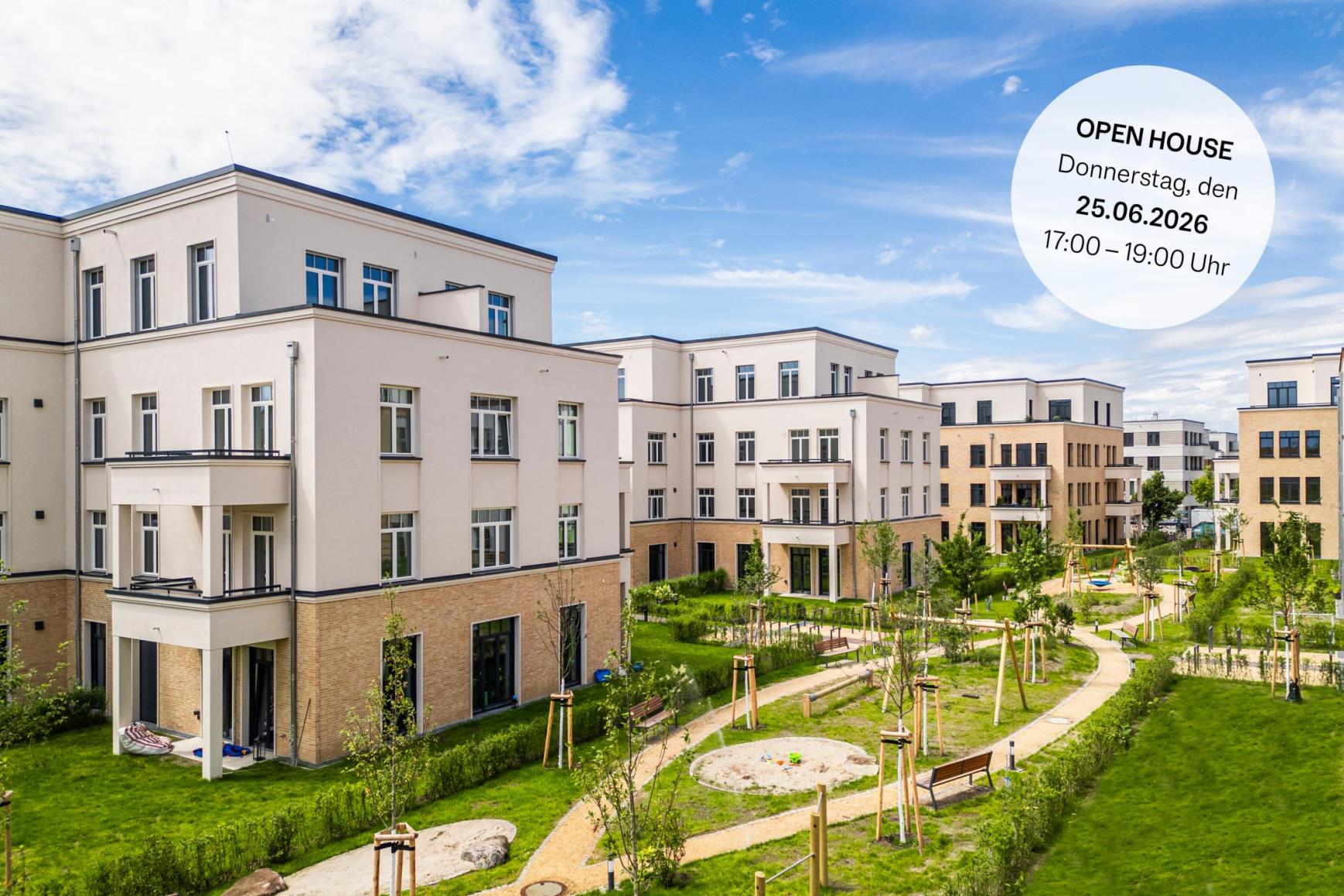 Modern apartment buildings with beige facades surround a green courtyard with a playground under a blue sky. Open house text.