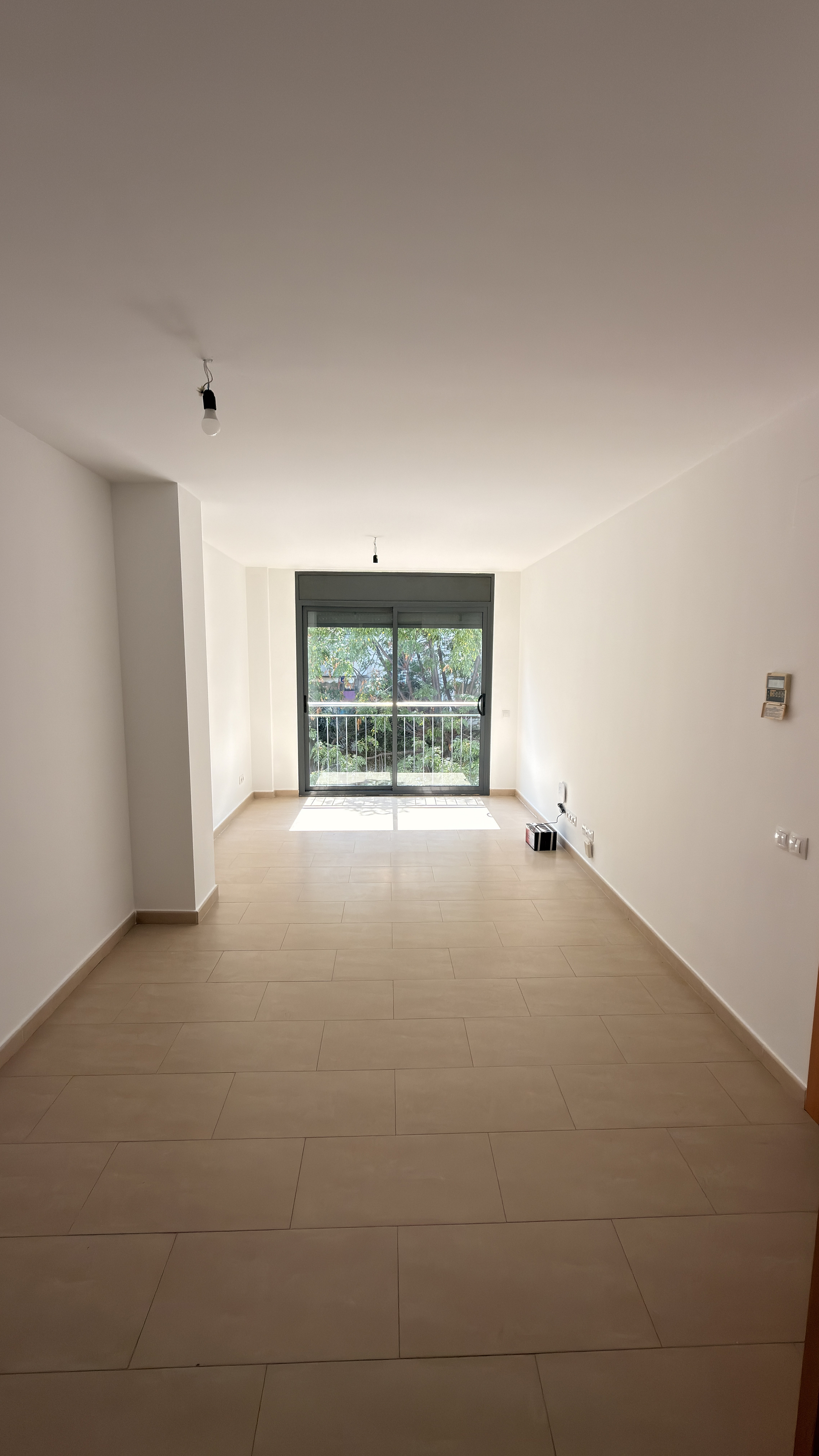 2-bedroom apartment with a patio and green views in Sitges, just minutes from the beaches and 40 minutes by train from Barcelona