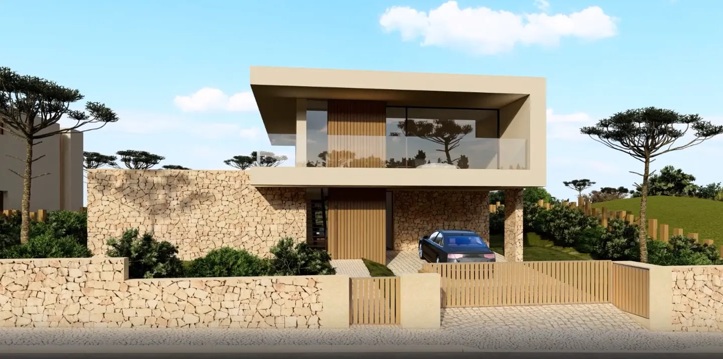 Two-story modern house with stone facade, wood accents, and a car parked in the driveway under a blue sky.