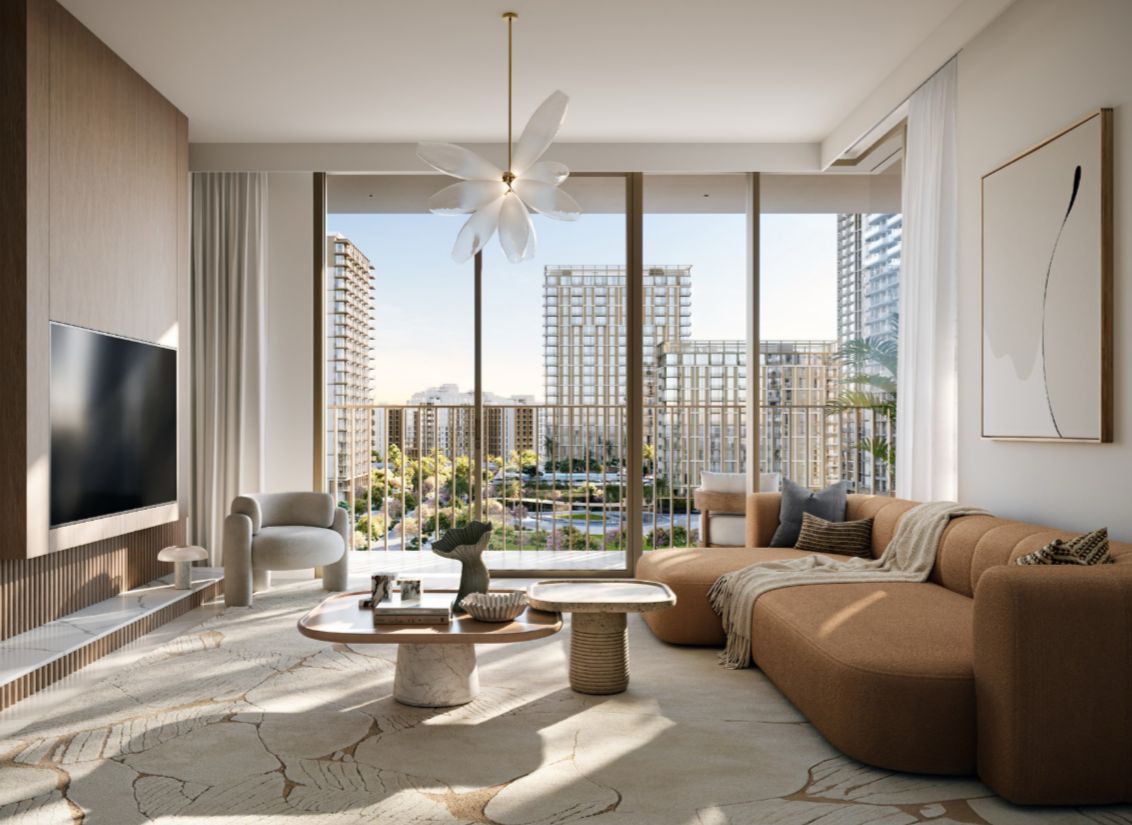 Modern living room with a tan sectional sofa, sculptural chandelier, and floor-to-ceiling windows overlooking city towers. [AI-generated text]