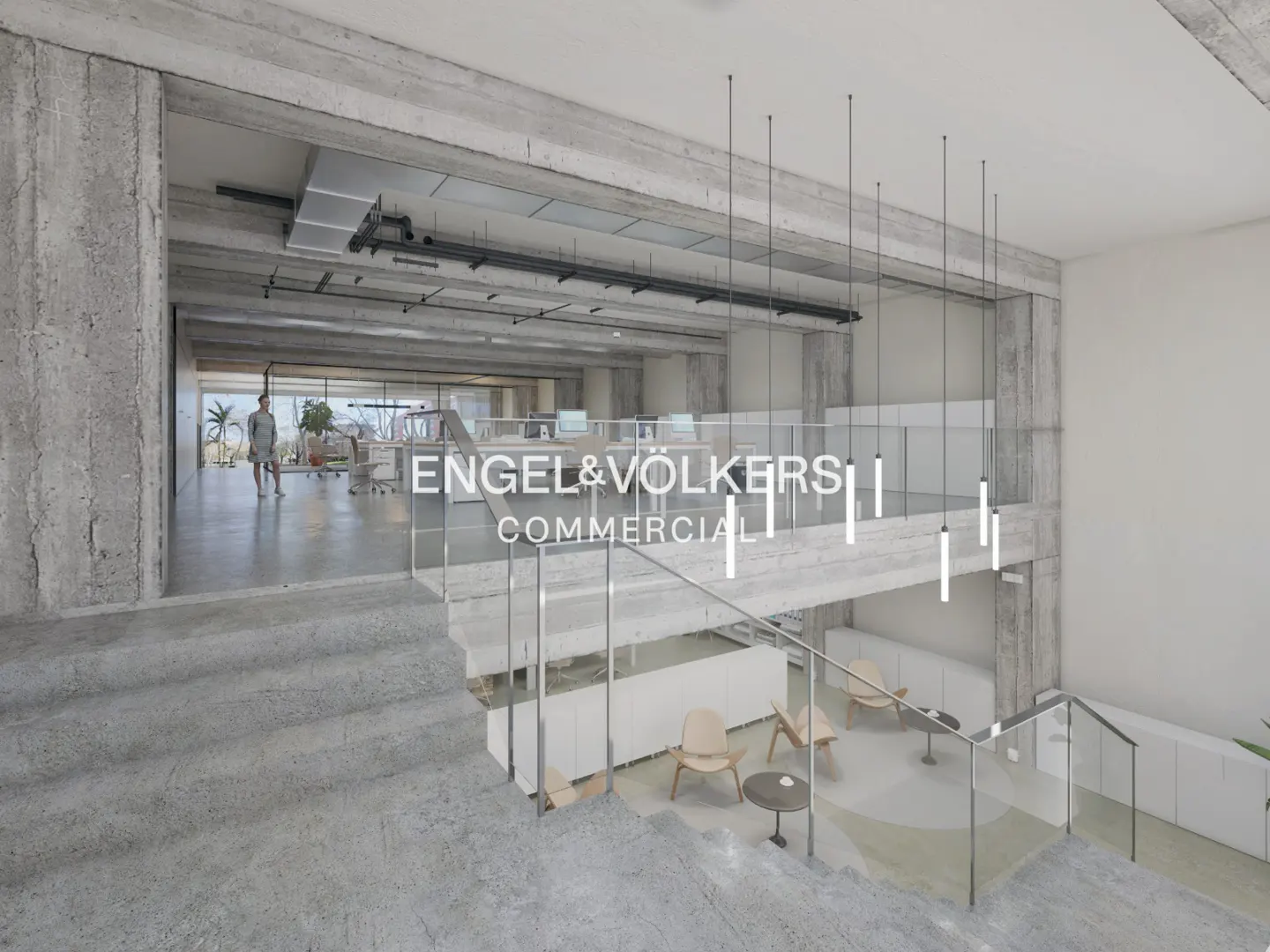 Engel & Völkers Commercial office interior. Concrete walls, glass railings, and modern furniture. Natural light fills the space.