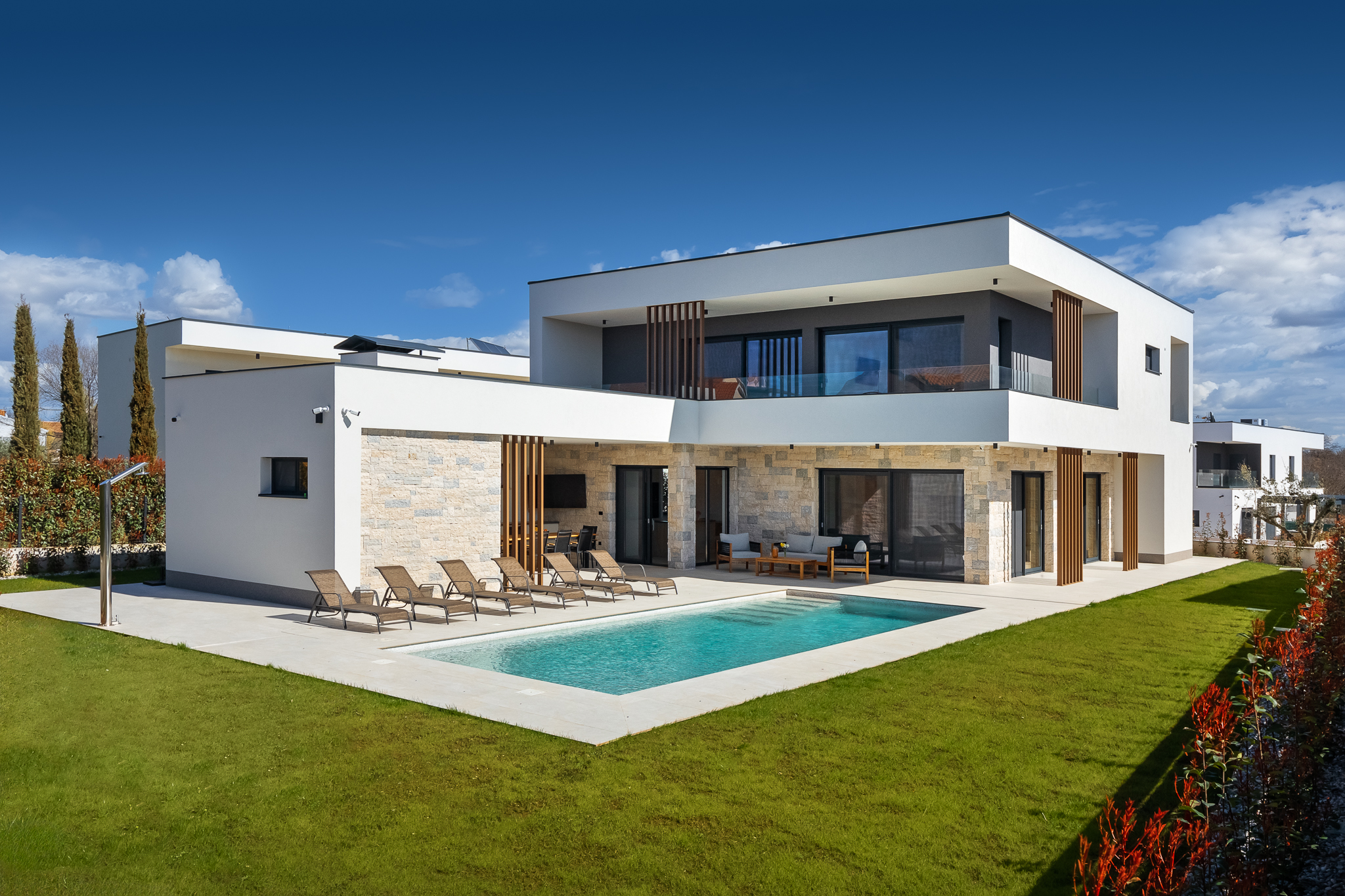 Modern designer villa with heated pool in prime location near Poreč