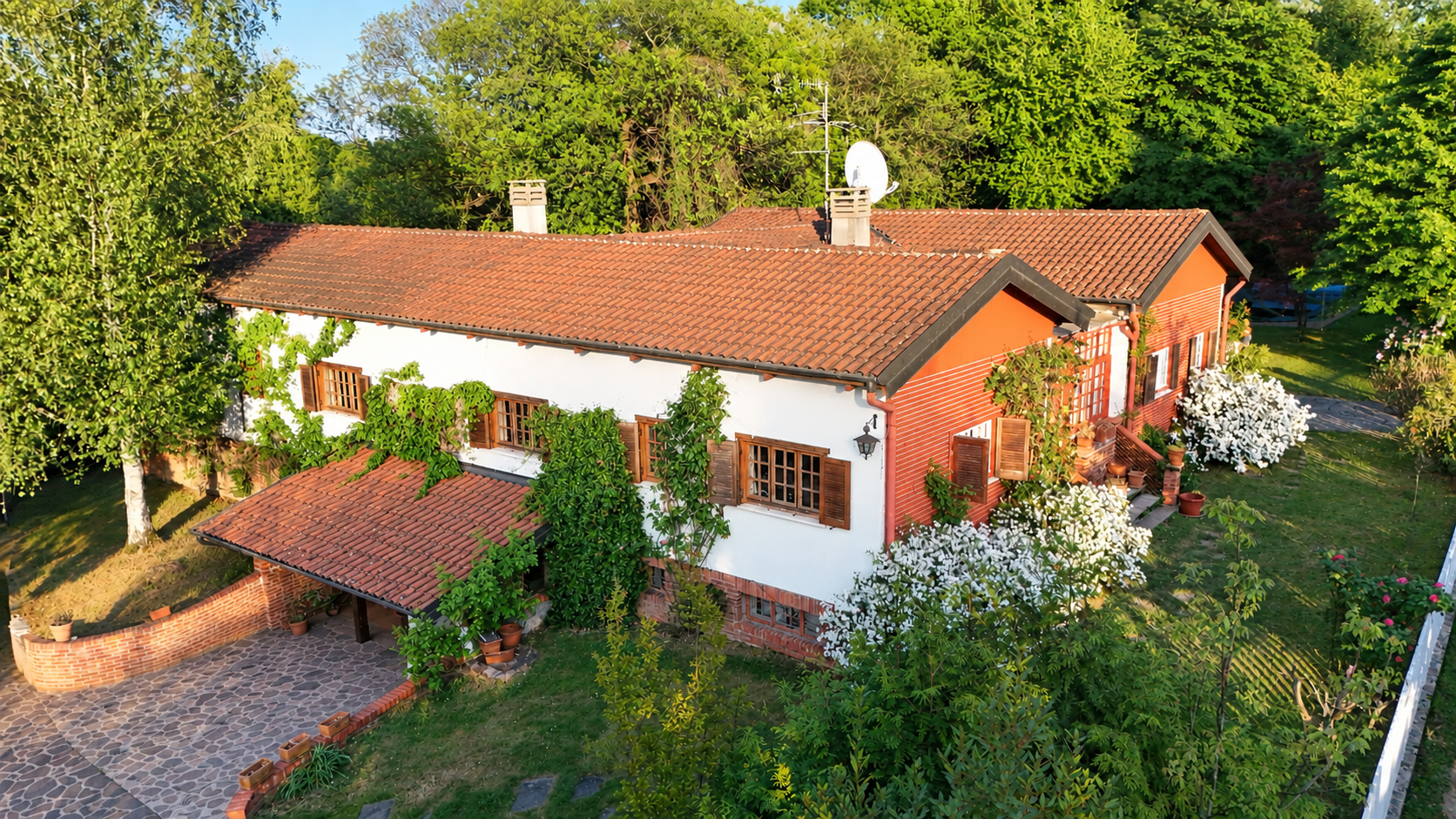 Villa with pool surrounded by greenery