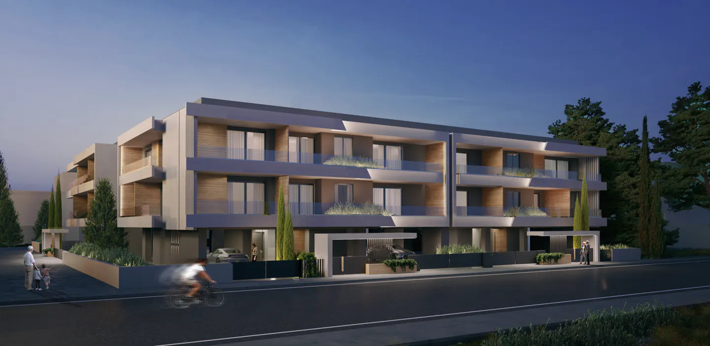 Modern, three-story apartment building with balconies and wood accents. A cyclist rides by on the street in front.