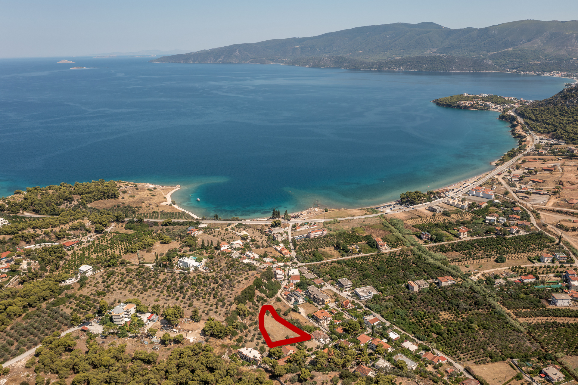 Amphitheatrical seaside plot with panoramic sea views in Kechries, Corinthia
