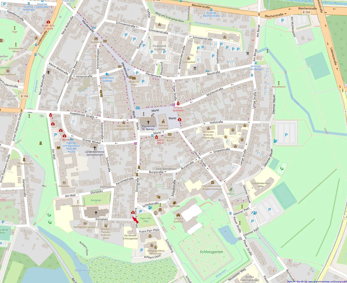 Map view of Güstrow, Germany, showing streets, buildings, parks, and the Schlossgarten in the lower right.
