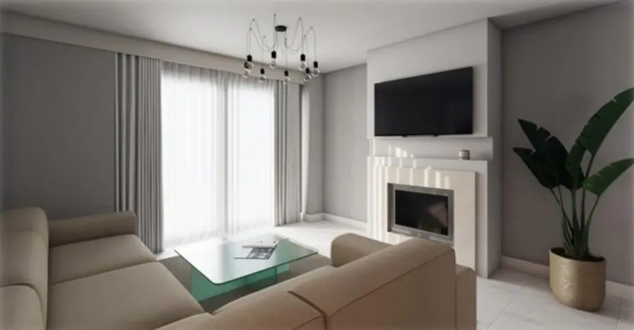 Living room with beige sectional sofa, glass table, fireplace with TV, and a potted plant. Gray walls and curtains.