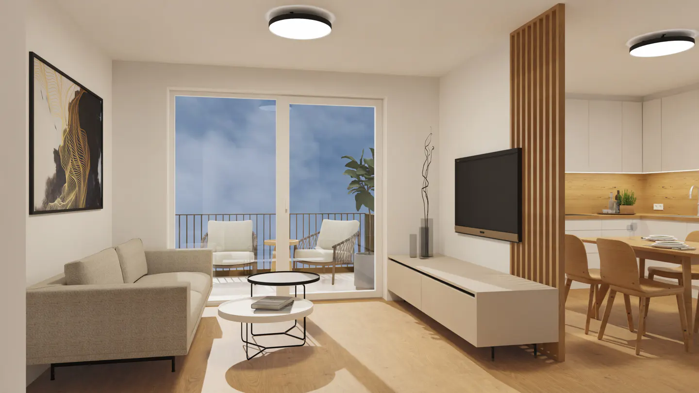 Living room with a beige sofa, white walls, and a balcony with chairs. A TV is mounted on the wall next to a wooden slat divider.