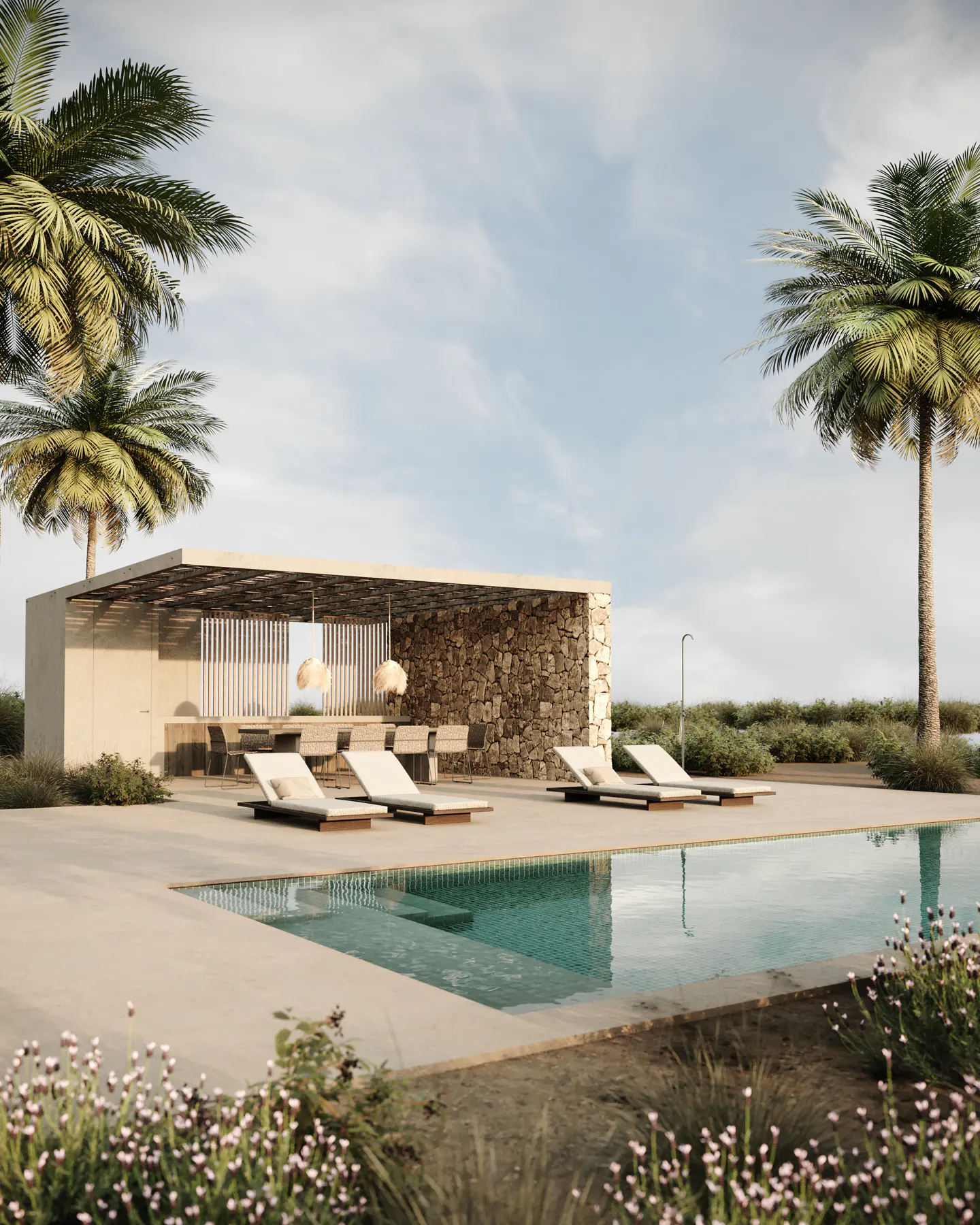 Luxury outdoor space with a pool, lounge chairs, and a stone bar area under a pergola, framed by palm trees against a blue sky.