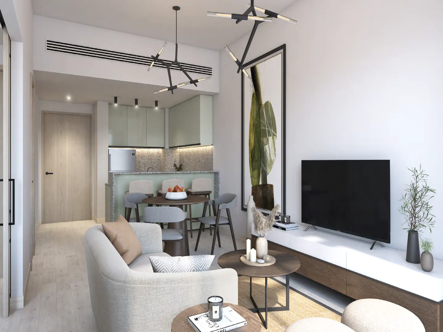 A modern apartment interior with a light-colored sofa, round tables, a TV, and a kitchen area with a dining table.