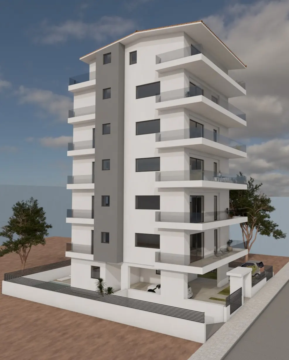 Modern white apartment building with gray accents, multiple balconies, and cars parked underneath.