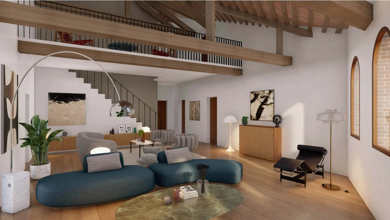 Open-concept living room with exposed beams, wood floors, and blue sofas. A staircase leads to a loft area with red chairs.