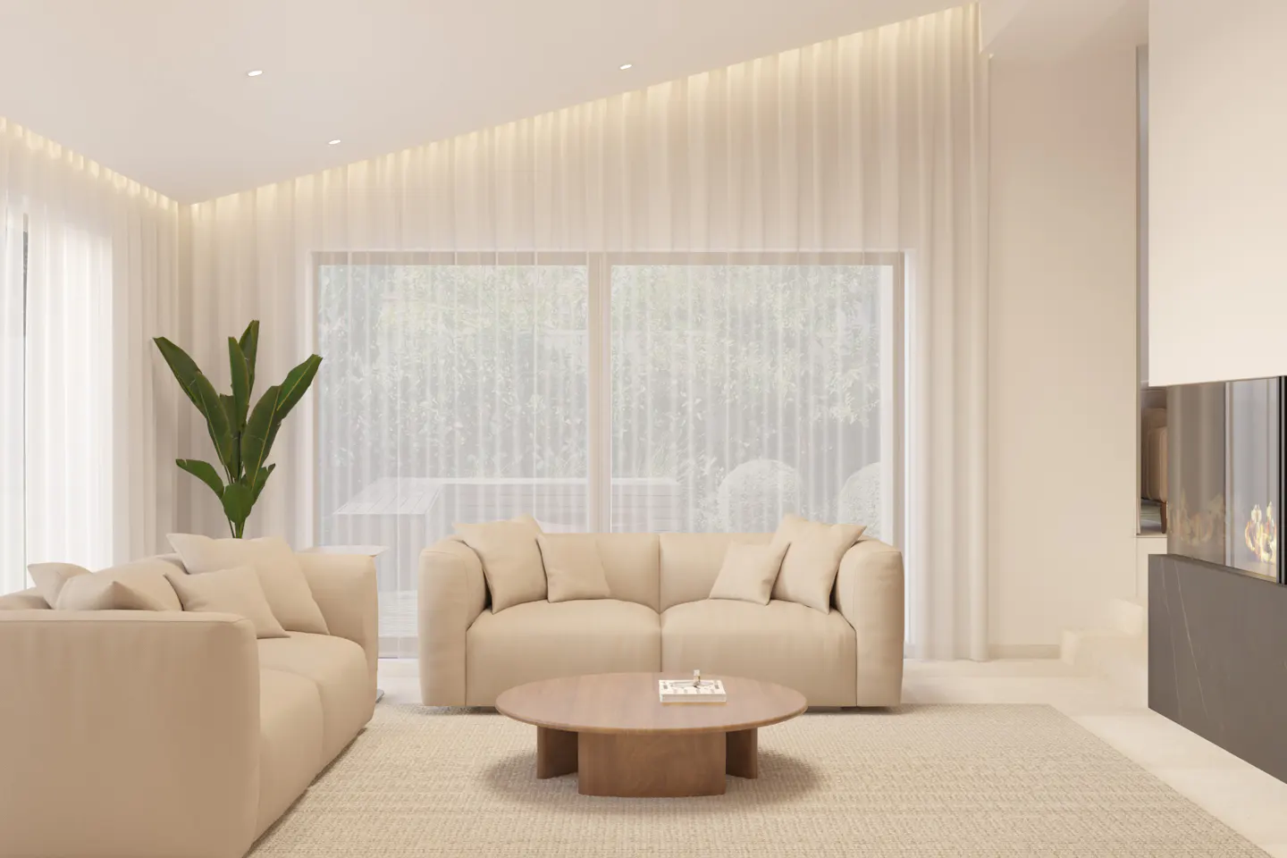 Bright living room with beige sofas, a round coffee table, and a large window with sheer white curtains. A plant adds a touch of green.