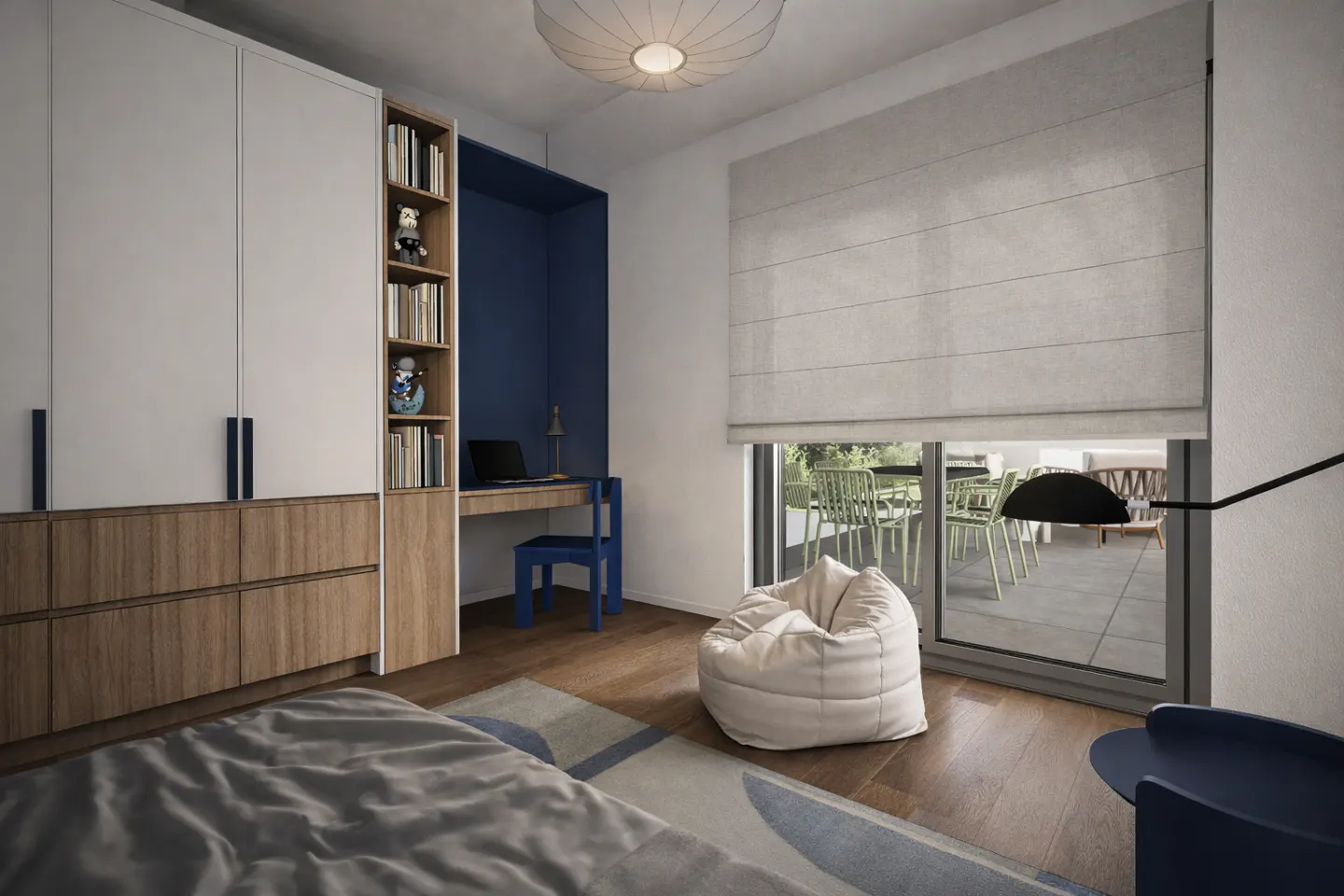 Bedroom with a bed, wardrobe, desk, and window. The walls are white, and the floor is wood. A beanbag chair sits near the window.