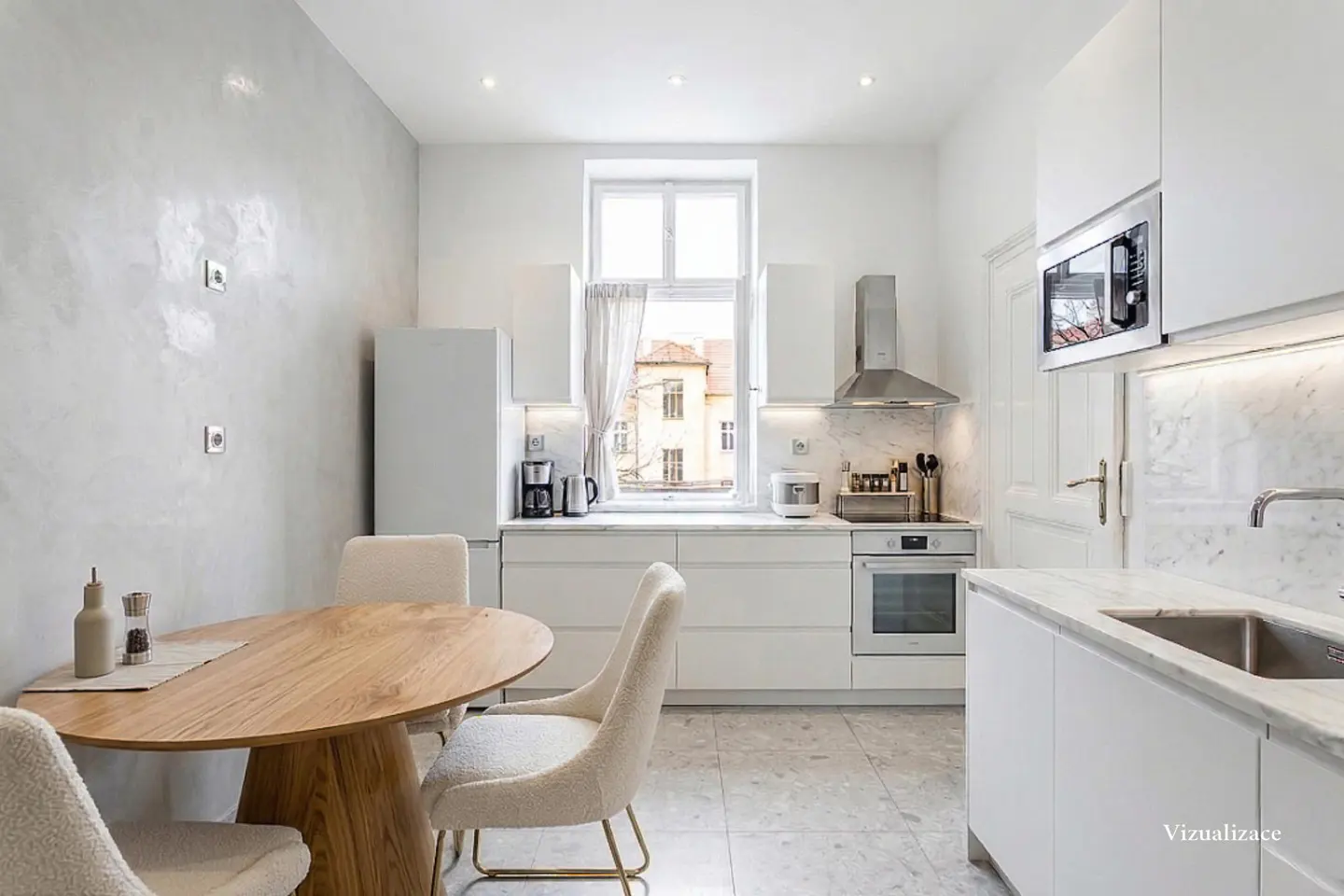 Bright, modern kitchen with white cabinets, marble countertops, and stainless steel appliances. A wooden table and chairs sit to the left.