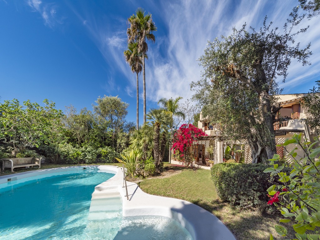 Unique, stylish villa with a large pool, tropical garden, and sea views, in exclusive