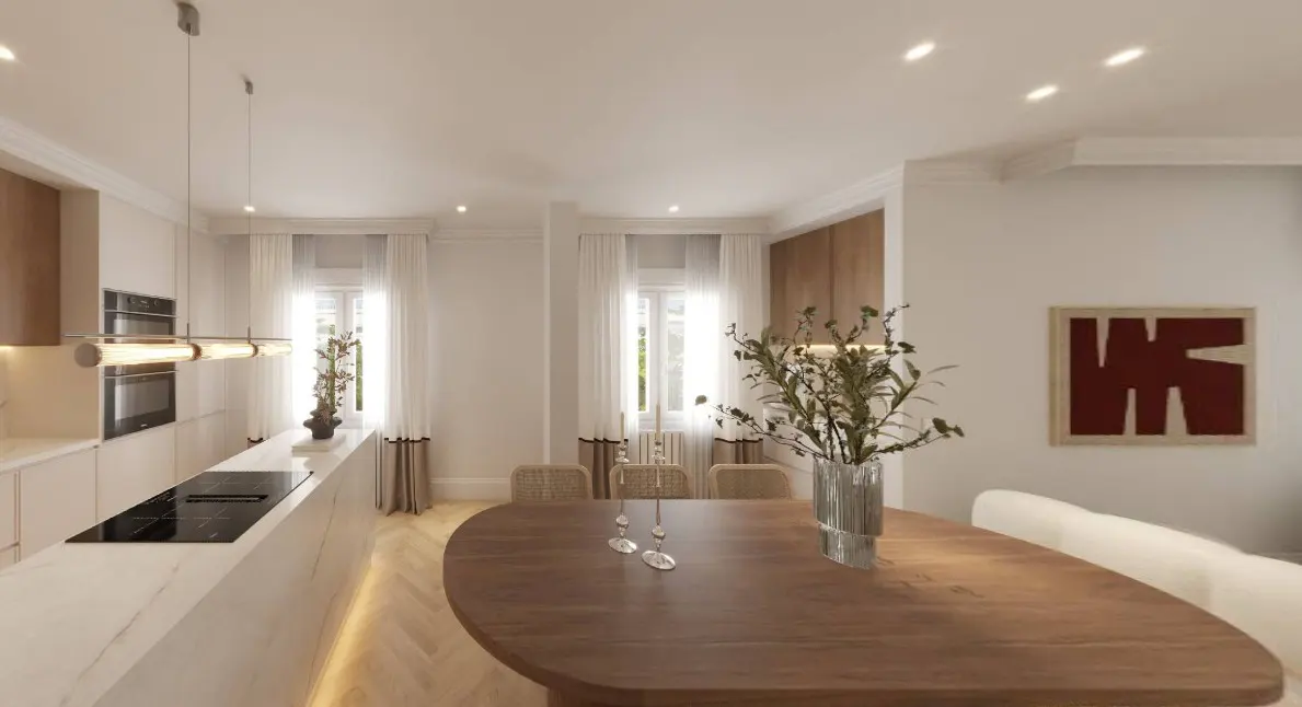 A bright, modern kitchen and dining area with a wood table, white cabinets, and large windows with sheer curtains.