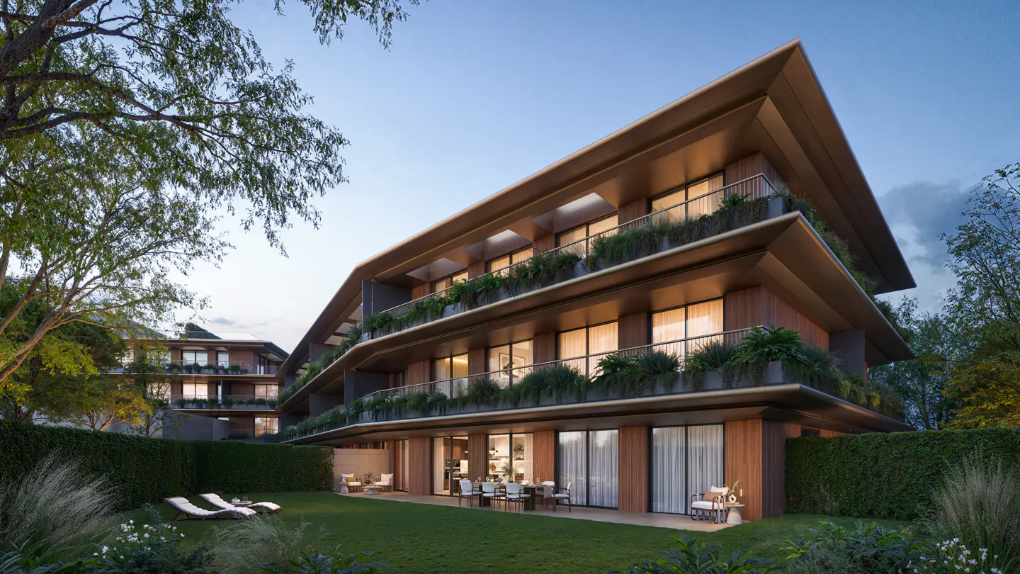 Exterior view of a modern, multi-story apartment building with wood paneling, balconies with plants, and a green lawn with lounge chairs.