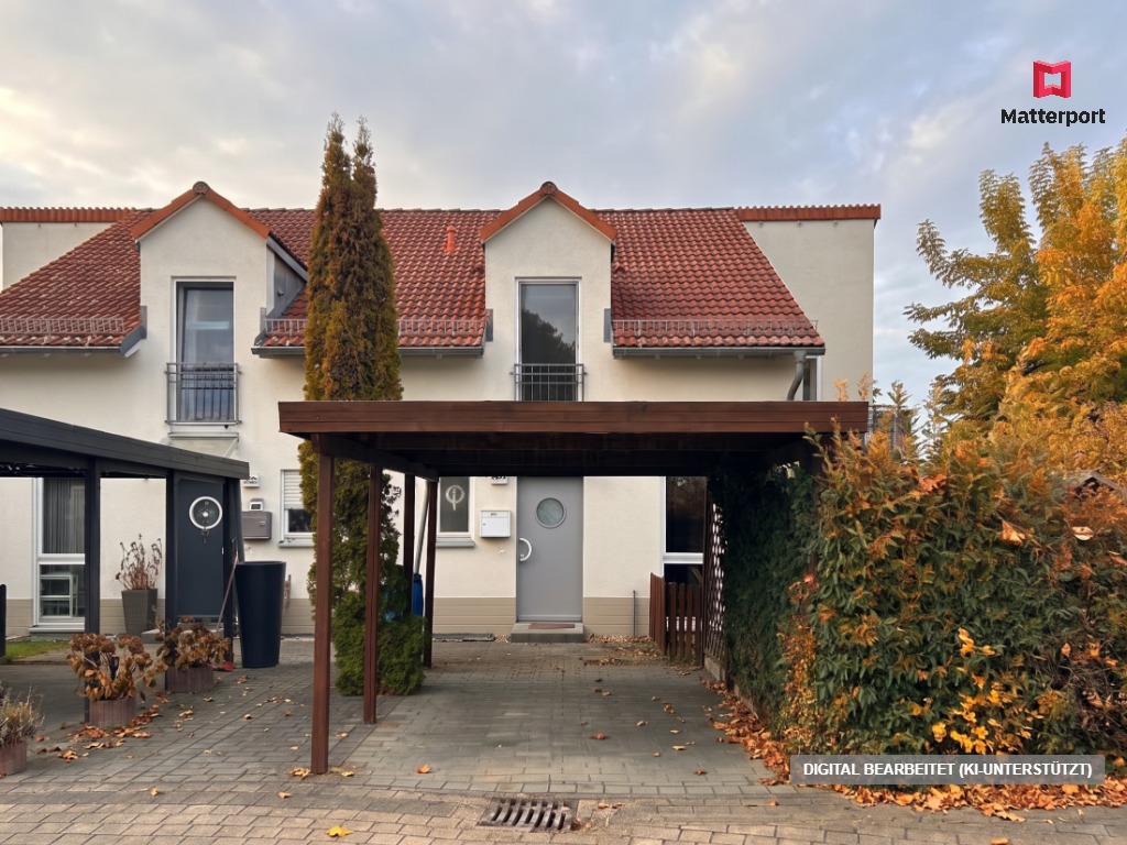 Two-story white house with a red tiled roof, a wooden carport in the front, and autumn trees on a paved driveway. [AI-generated text]