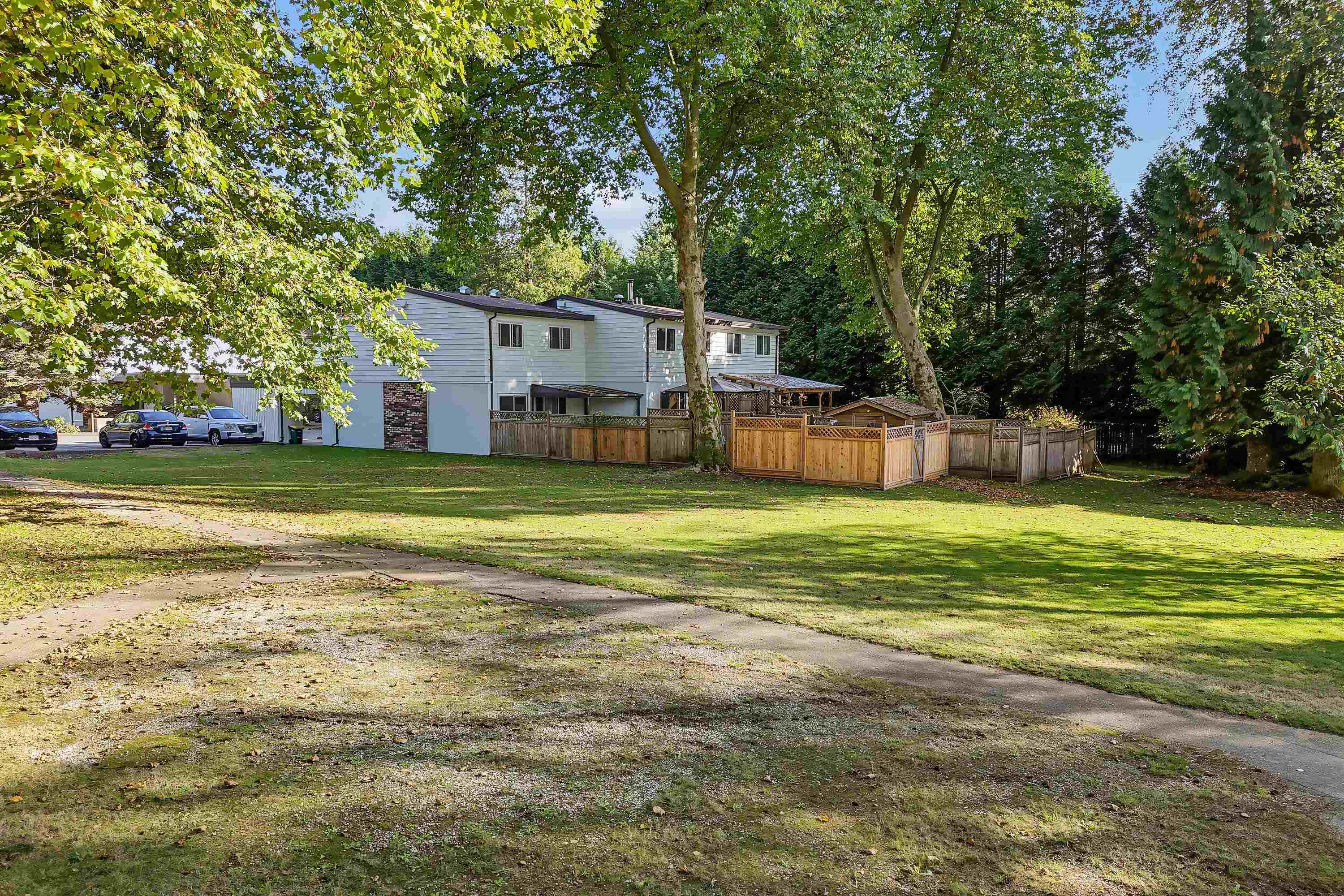 End Unit with Expansive Fenced Yard and Green Space