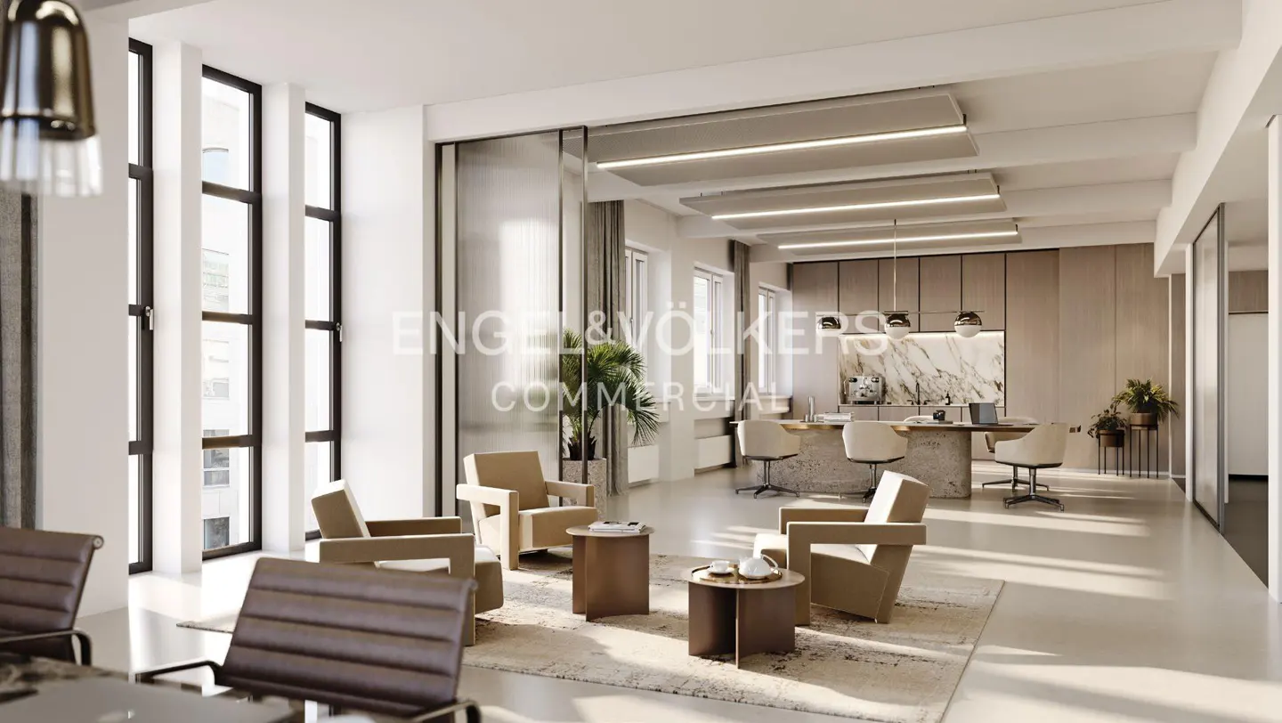 Bright, modern office space with tan chairs, brown tables, and large windows. Engel & Völkers logo visible on glass wall.