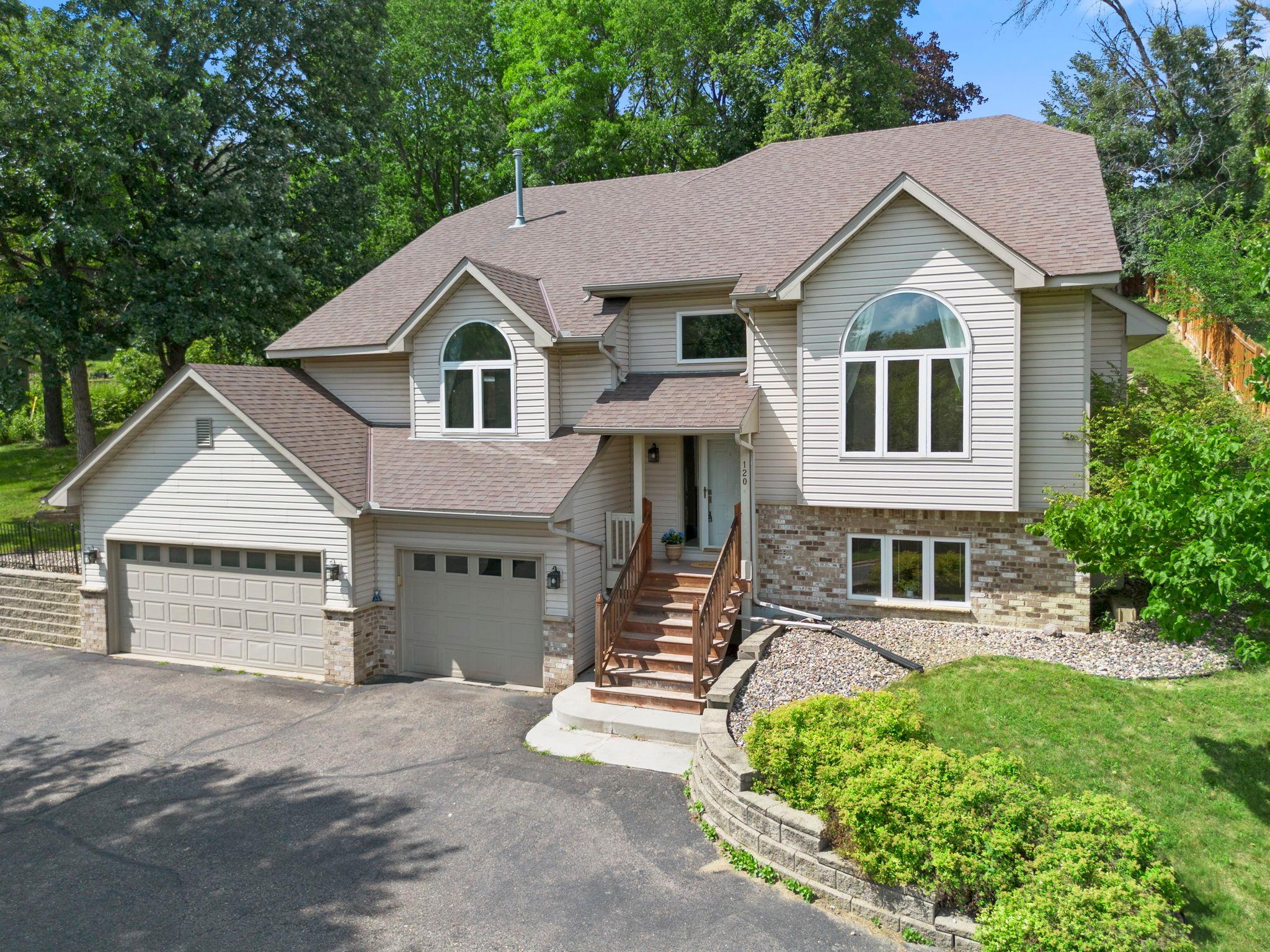 Modern Burnsville Luxe: Glass Railings & In-Law Suite