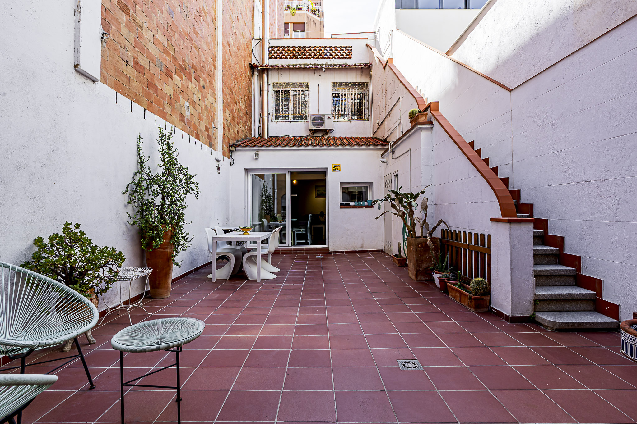 Discover an elegant renovated house with parking, terrace, and patio in Sant Andreu.