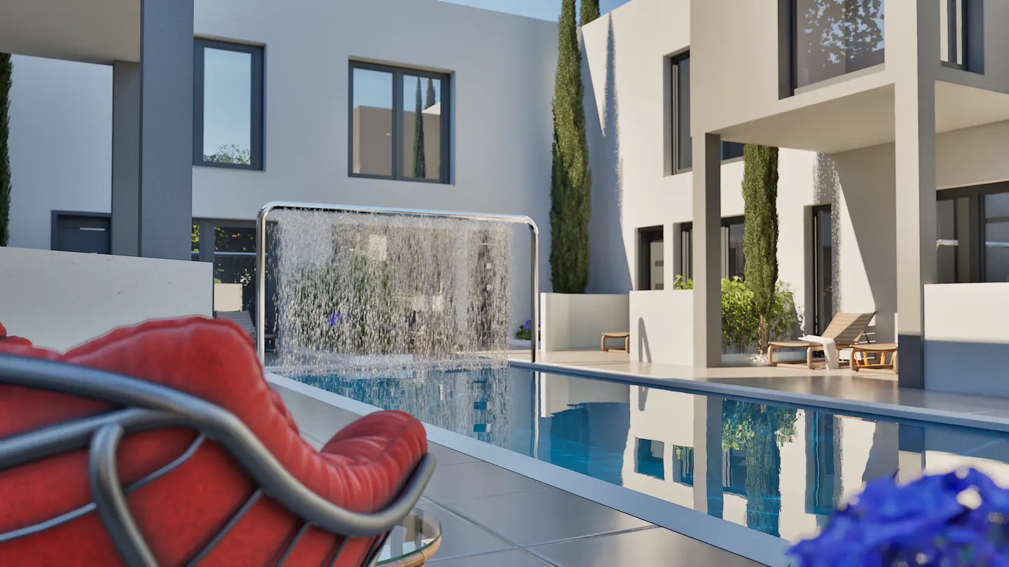 Modern home exterior with a pool, waterfall feature, and red chair in the foreground. Tall trees and white walls create a serene atmosphere.
