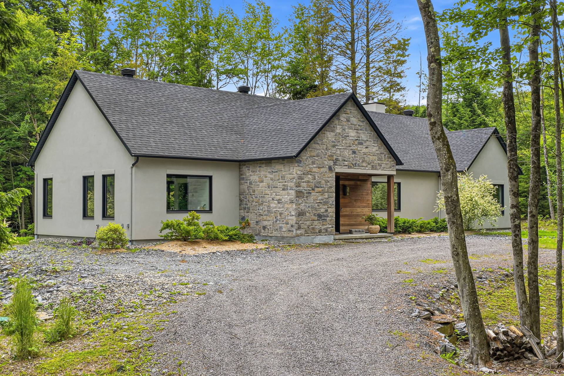 Property embodies the art of lake living on a wooded lot