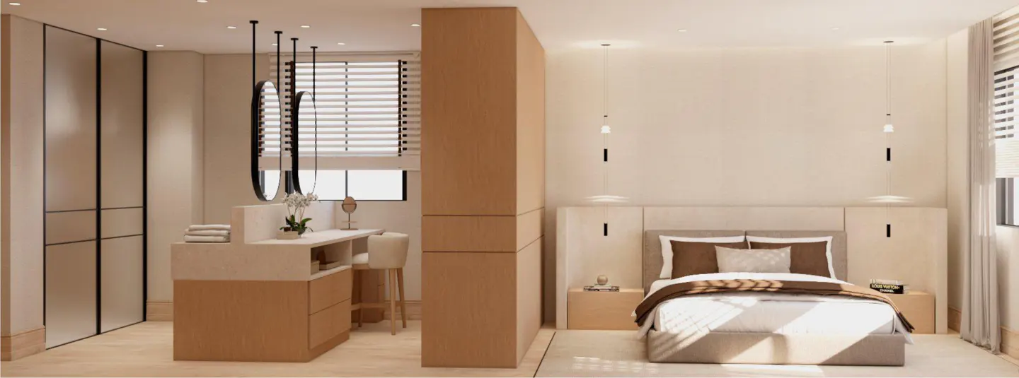 Bedroom with a vanity area. The bed has brown and white pillows. The vanity has three mirrors and a white chair. The walls are white.