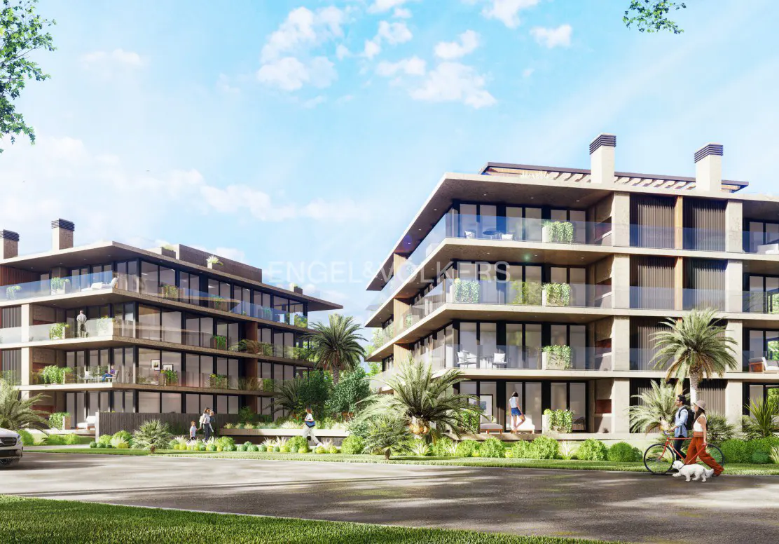 Modern apartment buildings with glass balconies, palm trees, and people walking or cycling on a sunny day.