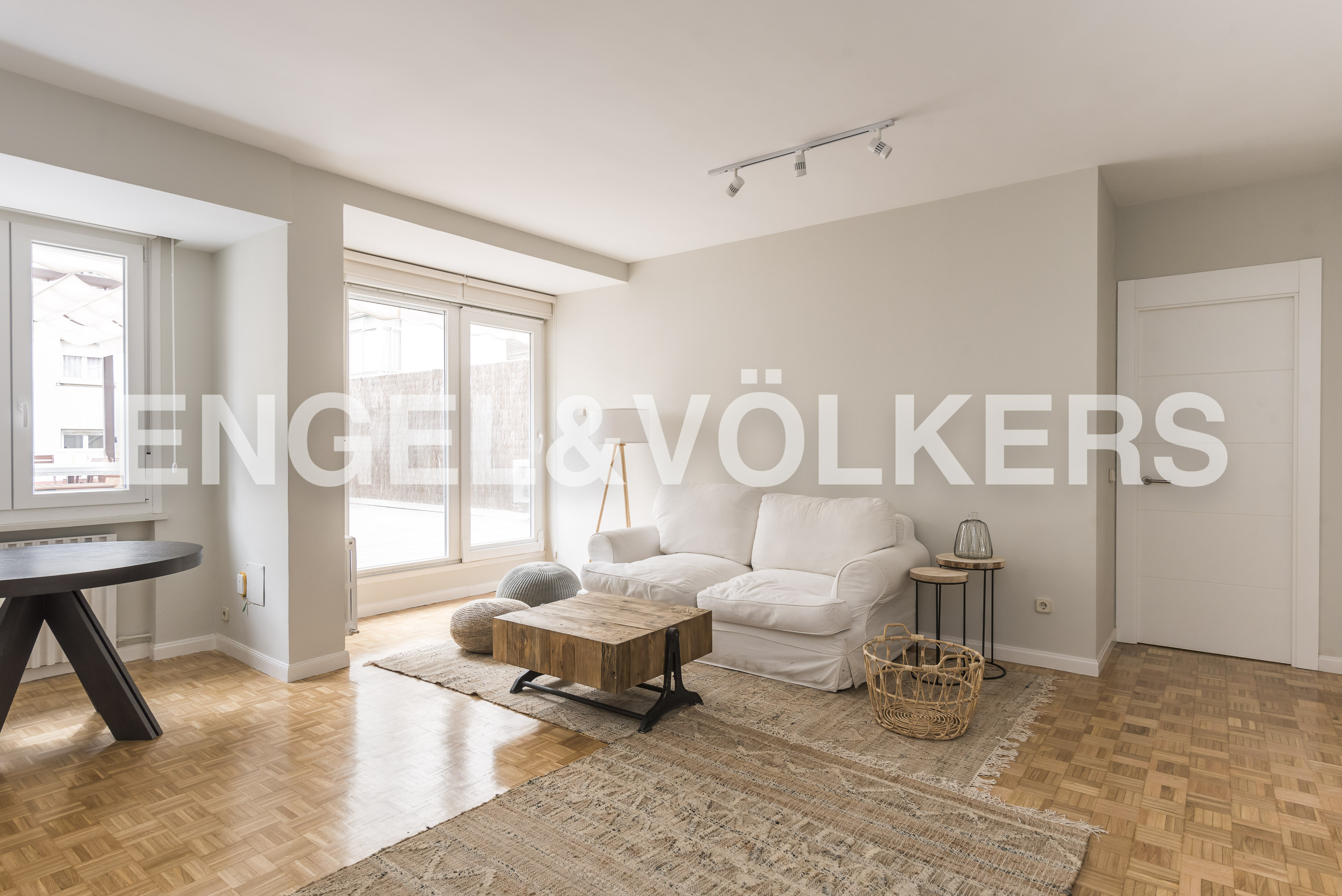 Bright apartment with big patio and garage.
