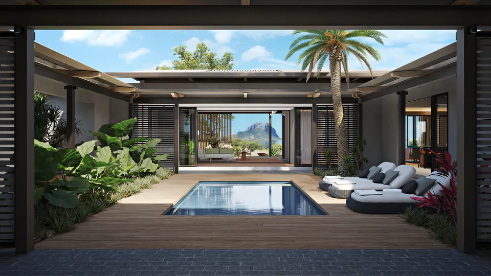 Outdoor patio with a small pool, wooden deck, lounge chairs, and tropical plants. A palm tree stands tall near the pool. Mountain view in the background.